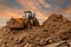 Wheel loader digging the soil in a construction site